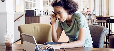 Young woman studying in coffee shop