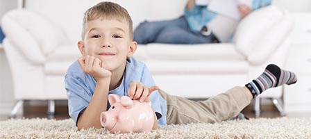 Kid relaxing with savings bank