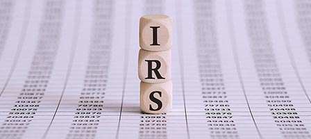 Wooden IRS cubes on data sheet