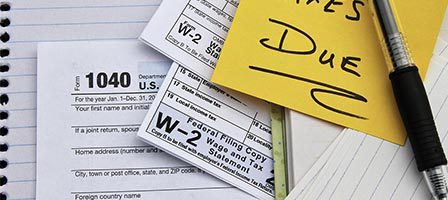 Tax forms and reminder note