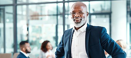 Smiling businessman in modern office