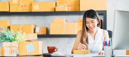 Entrepreneur organizing shipping boxes