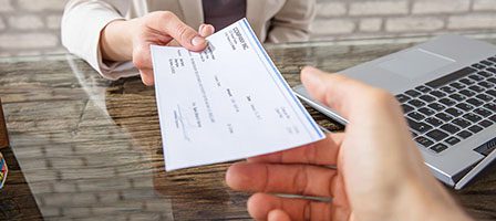 Check being passed between hands