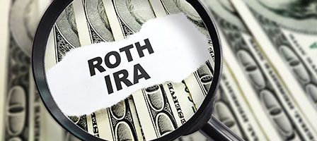 Magnifying glass on Roth IRA concept