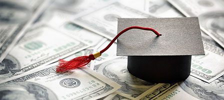 Education costs symbolized by money and cap