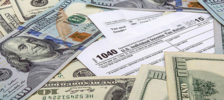 Money and 1040 tax form layout
