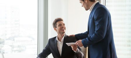 Professional interaction between two office workers