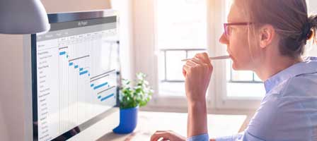 Individual working on scheduling software