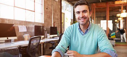 Casual workplace with smiling employee