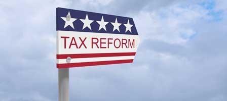 Tax reform directional sign under cloudy sky