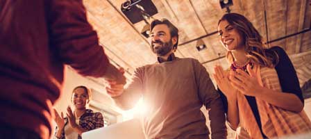 Business handshake and applause