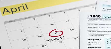 Tax form beside April calendar