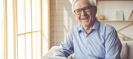 Smiling elderly man in glasses