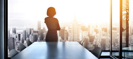 Silhouette of woman in office