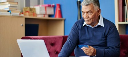 Man shopping online with credit card