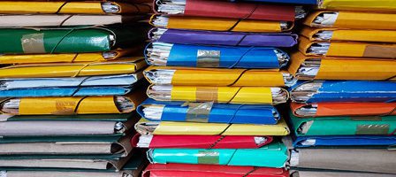 Multicolored files tied with strings