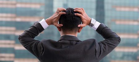 Businessman stressed with cityscape background