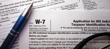 Close-up of tax form W-7 documents