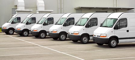 White delivery vans parked in a row
