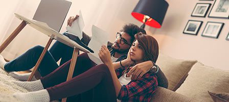 Couple reviewing documents together at home