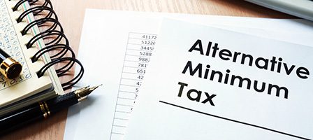 Alternative Minimum Tax document on desk