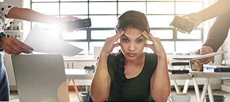 Woman coping with work stress and pressure