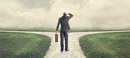 Man at crossroads with briefcase