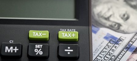 Finance calculator and money background.