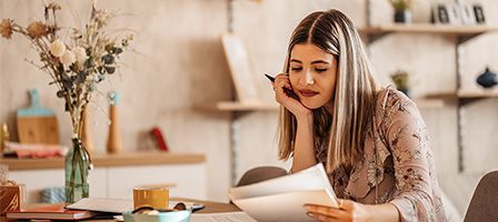 Person reviewing papers in cozy setting