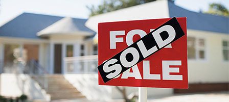 Real estate sold sign outdoors