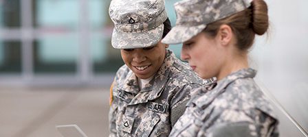 Military personnel reviewing documents