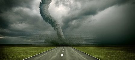 Dark storm clouds and swirling tornado