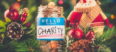 Festive jar labeled "Charity" with decorations