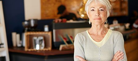 Woman standing confidently in a café