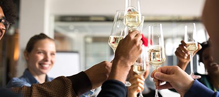 Group celebration with champagne flutes