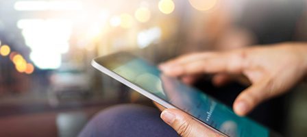 Touchscreen tablet in use with blurred background