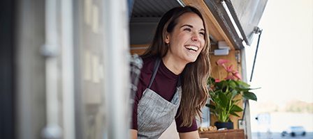 Woman smiling in a food truck