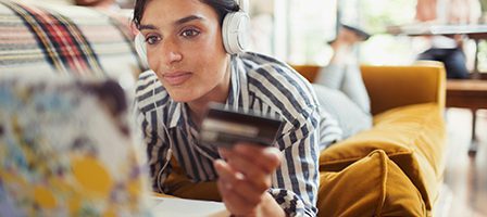 Relaxing on couch with online purchase