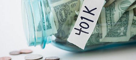 Jar labeled 401K with cash