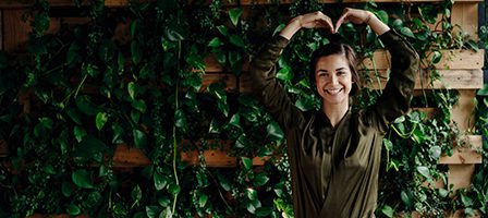 Woman forming heart shape with hands