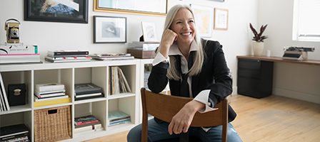 Happy woman sitting on chair
