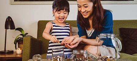 Child learning about finances with mom