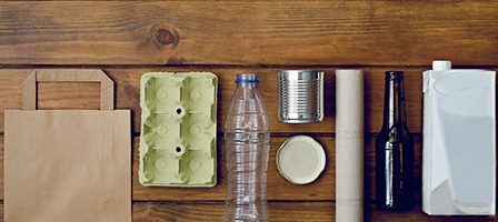 Recyclable materials on wooden table