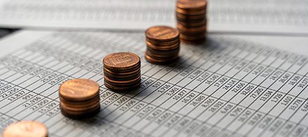 Financial data with stacked pennies