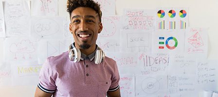 Man in pink shirt, creative workspace background
