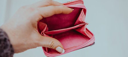 Open pink wallet showing no contents