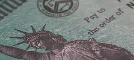 Government check featuring Liberty engraving