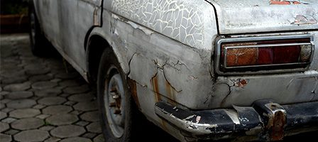 Old, rusty car with peeling paint