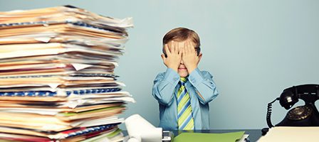 Young boy with office documents
