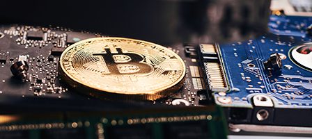 Bitcoin coin on computer hardware